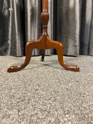 A circular mahogany wine table featuring a moulded dished top, a turned baluster stem, and a three-legged cabriole tripod base. View III