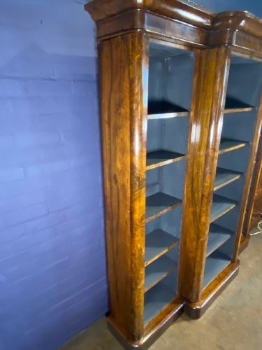 A large Victorian burr walnut breakfront bookcase featuring open adjustable shelves and a dark painted interior. View VII