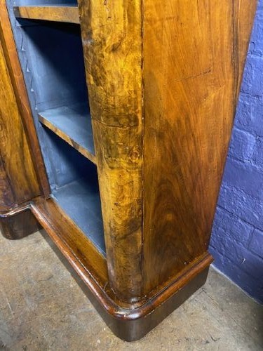 A large Victorian burr walnut breakfront bookcase featuring open adjustable shelves and a dark painted interior. View VIII