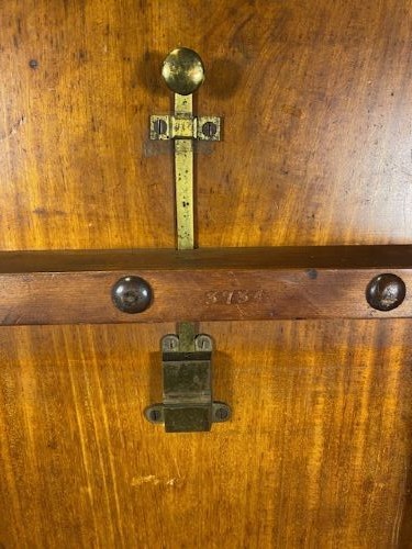A circular Victorian burr walnut tilt-top table displaying book-matched veneer figure, supported by a carved tripod pedestal base. View V