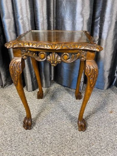 A set of three graduated walnut nesting tables featuring glass tops, shell carvings on the frieze, and cabriole legs. View IV