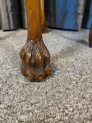A set of three graduated walnut nesting tables featuring glass tops, shell carvings on the frieze, and cabriole legs. View VI