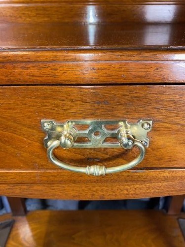 A tall walnut hall stand featuring a top scrolled crest, brass hooks, a diamond-shaped central mirror, blue ceramic tiles, a glove drawer, and umbrella holders with drip trays. View VIII
