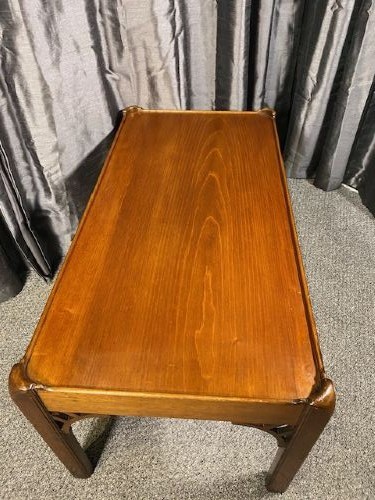 A low rectangular mahogany coffee table featuring a raised gallery rim and decorative pierced fretwork corner brackets on square legs. View IV