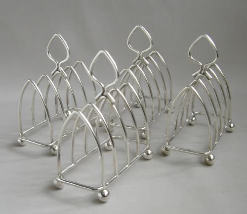 Set of Four Silver Toast Racks.