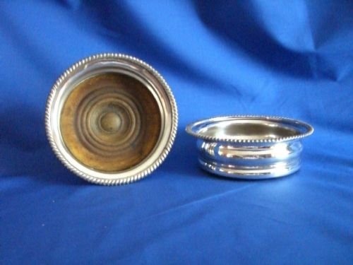 Pair Antique Silver-plated Wine Coasters.
