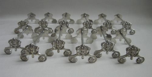 Set of Twelve Antique Silverplated Knife Rests.