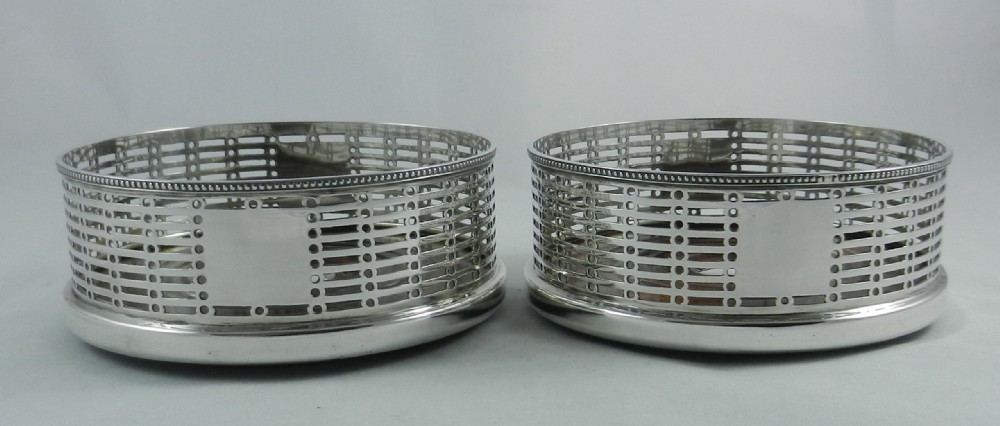 Antique Silver Wine Coasters.