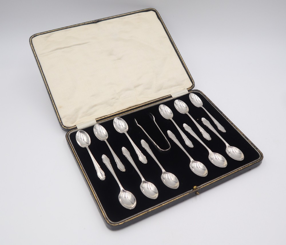 Cased Set Of 12 Silver Spoons & Tongs.