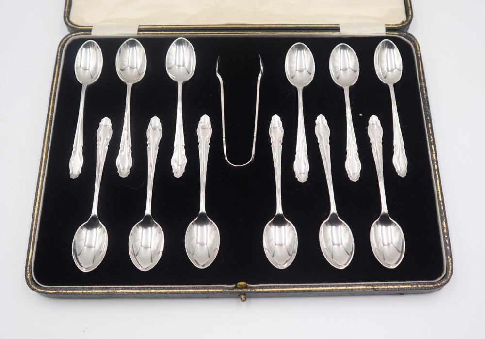 Cased Set Of 12 Silver Spoons & Tongs. View II