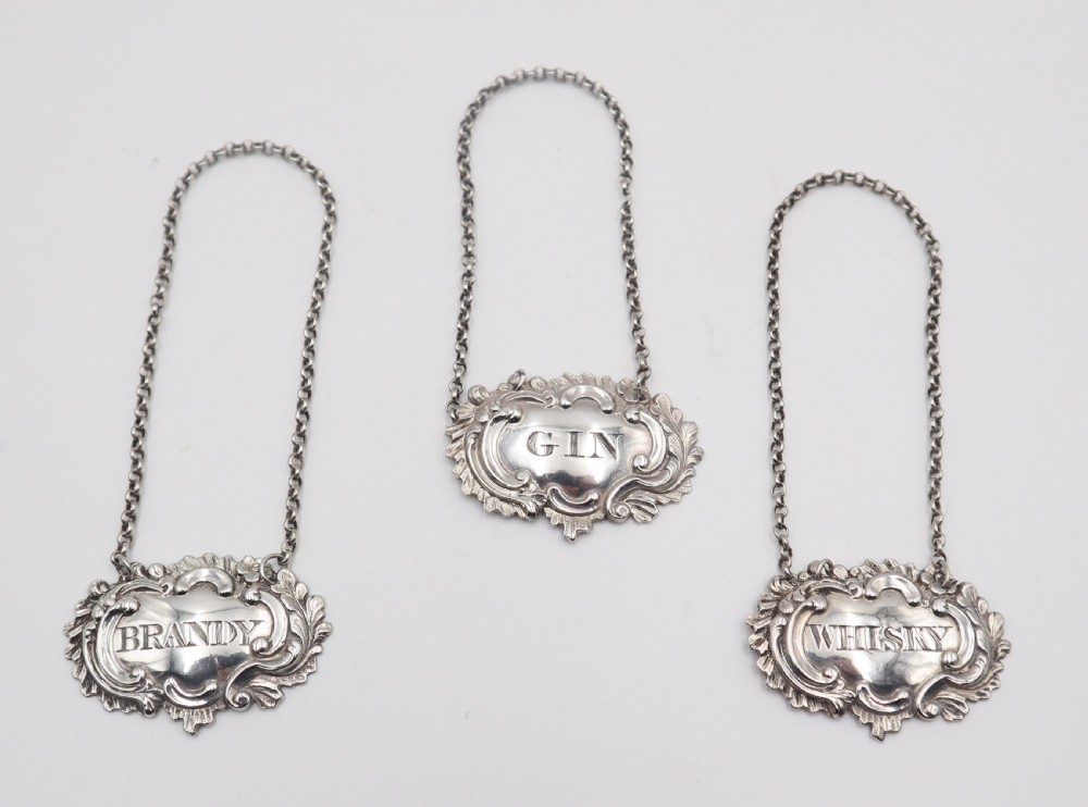 Set Of Antique Silver Decanter Labels.