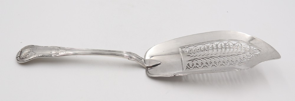An antique sterling silver fish slice featuring a pierced engraved blade and a fiddle and shell pattern handle. View II