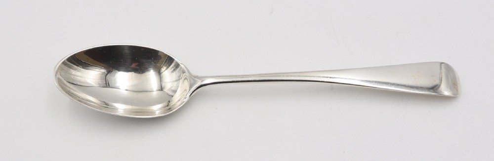 A complete antique silver cutlery set comprising table knives, forks, soup spoons, dessert spoons, and teaspoons arranged neatly on a white background. View X