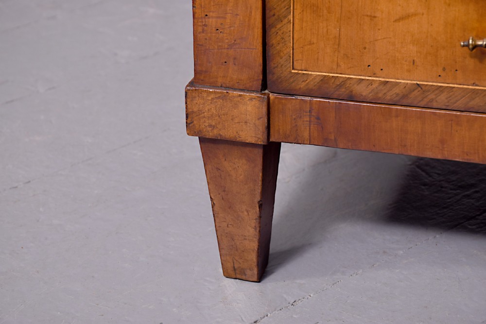 A 19th-century blonde walnut slant-front bureau featuring rosewood inlay, a central star motif on the lid, and three long drawers with decorative metal handles. View VIII
