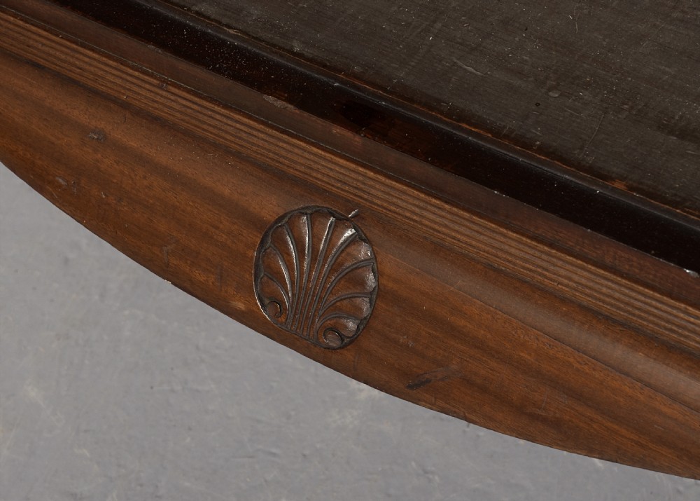 A wide dark mahogany open bookcase featuring twin double bays with multiple shelves, decorative inlay on the frieze, carved shell motifs on the lower apron, and cabriole legs ending in ball and claw feet. View IX