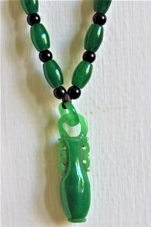 A Spinach Green Jade Necklace and Pendant