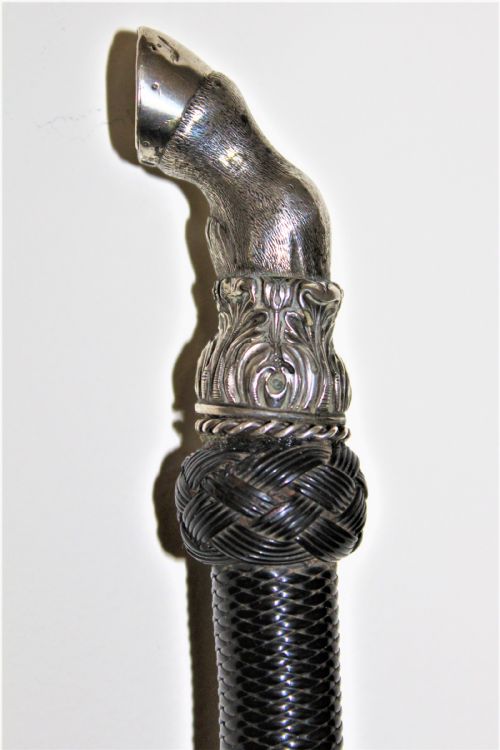 A Very Fine Riding Crop with a Well Cast White Metal Horses Hoof Handle and Nicely Woven Leather Shaft English Circa 1880 to 1900