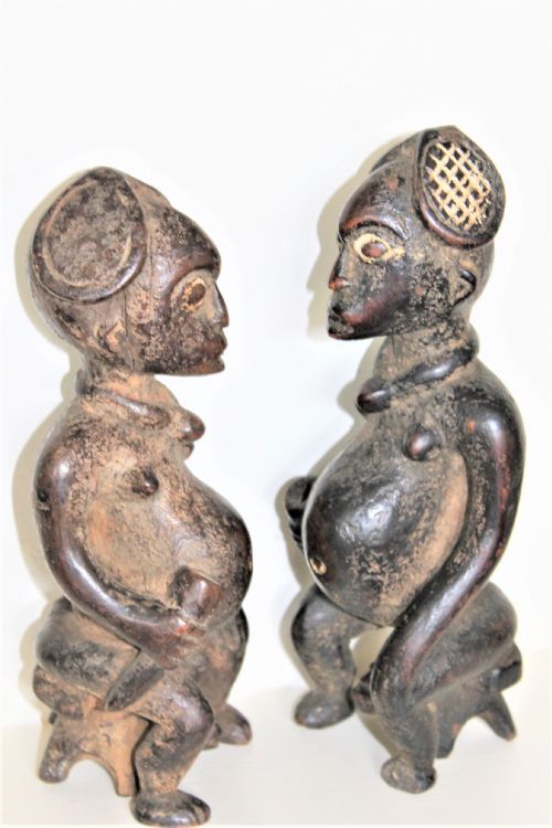 A Finely Carved and Charming Pair of Yoruba Wood Figurines with Elaborate Headdress and Pigments