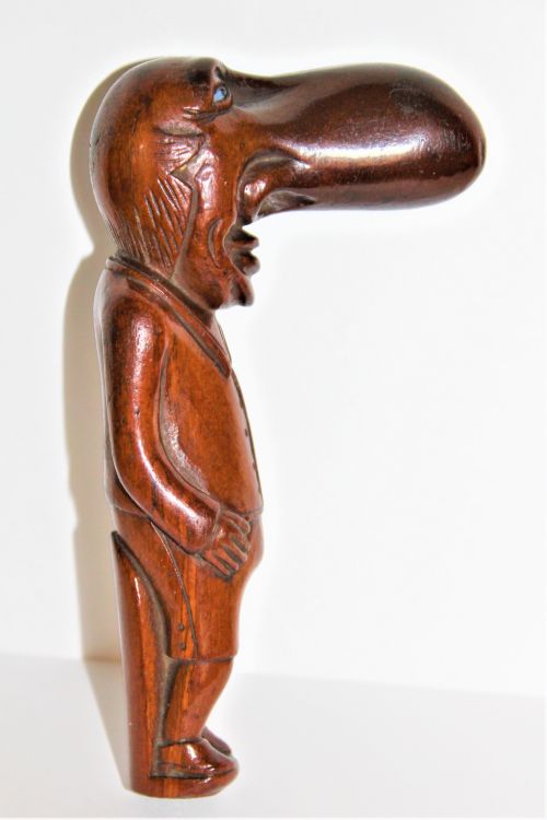 An Interesting and Amusing Hard Wood Carving of Ally Sloper with Glass Eyes