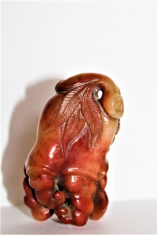 A Superb  and Tactile Carved Chinese Soapstone Fruiting Pod with a Bat Feeding Possibly a Netsuke