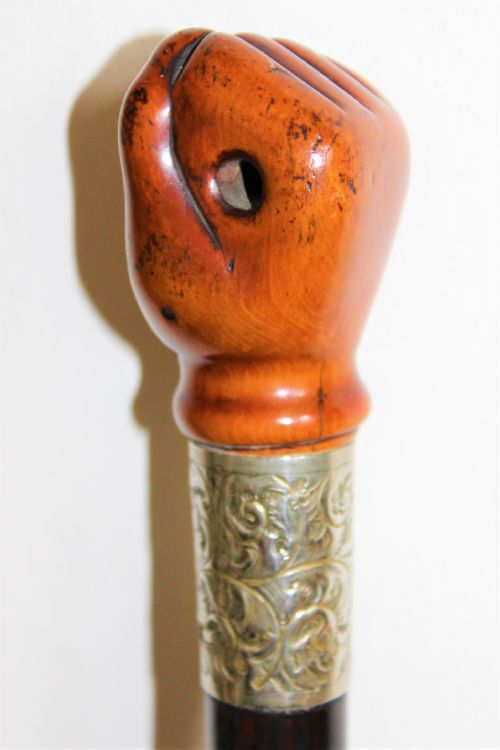 A VERY STYLISH WALKING STICK THE TOP CARVED IN FRUITWOOD AND MODELLED AS A CLENCHED FIST - ADDITIONAL PHOTO 1