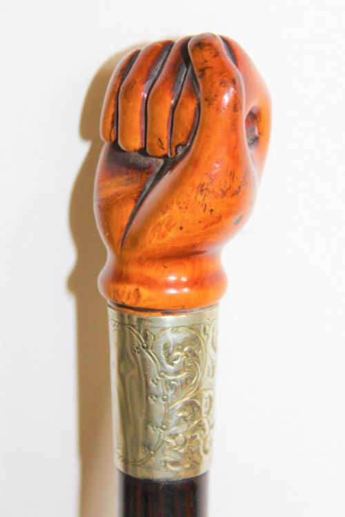 A VERY STYLISH WALKING STICK THE TOP CARVED IN FRUITWOOD AND MODELLED AS A CLENCHED FIST - ADDITIONAL PHOTO 2