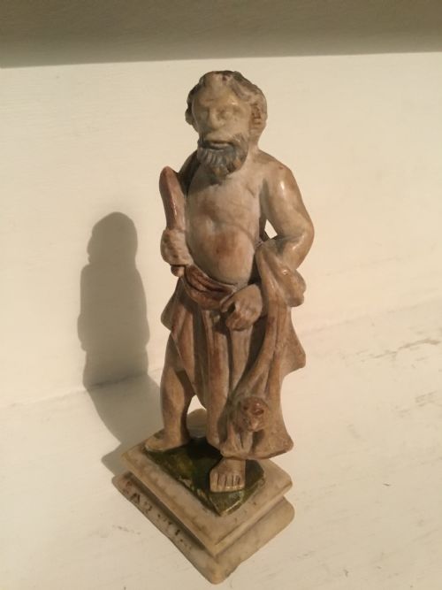 AN EARLY PROBABLY 17TH CENTURY CARVED MARBLE FIGURE OF A ROMAN PHILOSOPHER