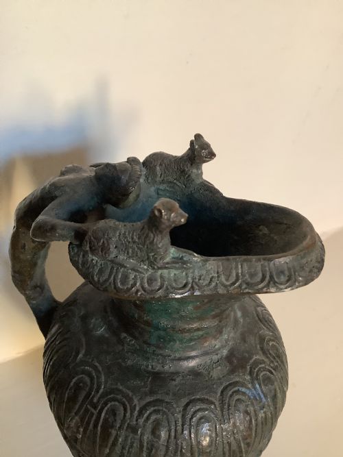 A HEAVILY PATINATED BRONZE JUG THE HANDLE DEPICTING DIONYSUS GOD OF WINE AND PLEASURE - ADDITIONAL PHOTO 5