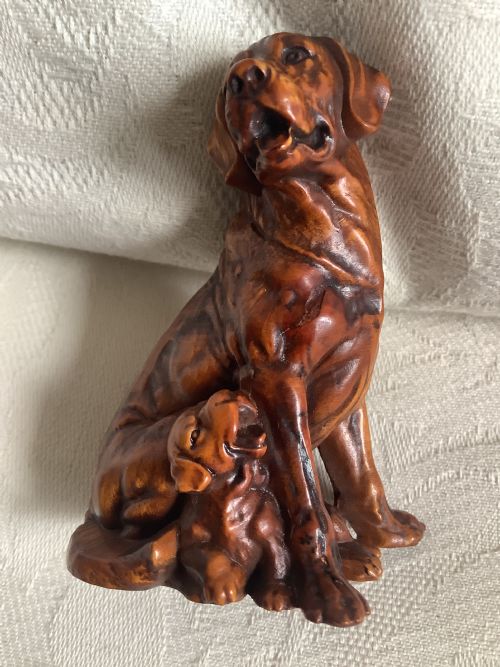 A Very Finely Carved Small Hardwood Figure of Dog and Pup