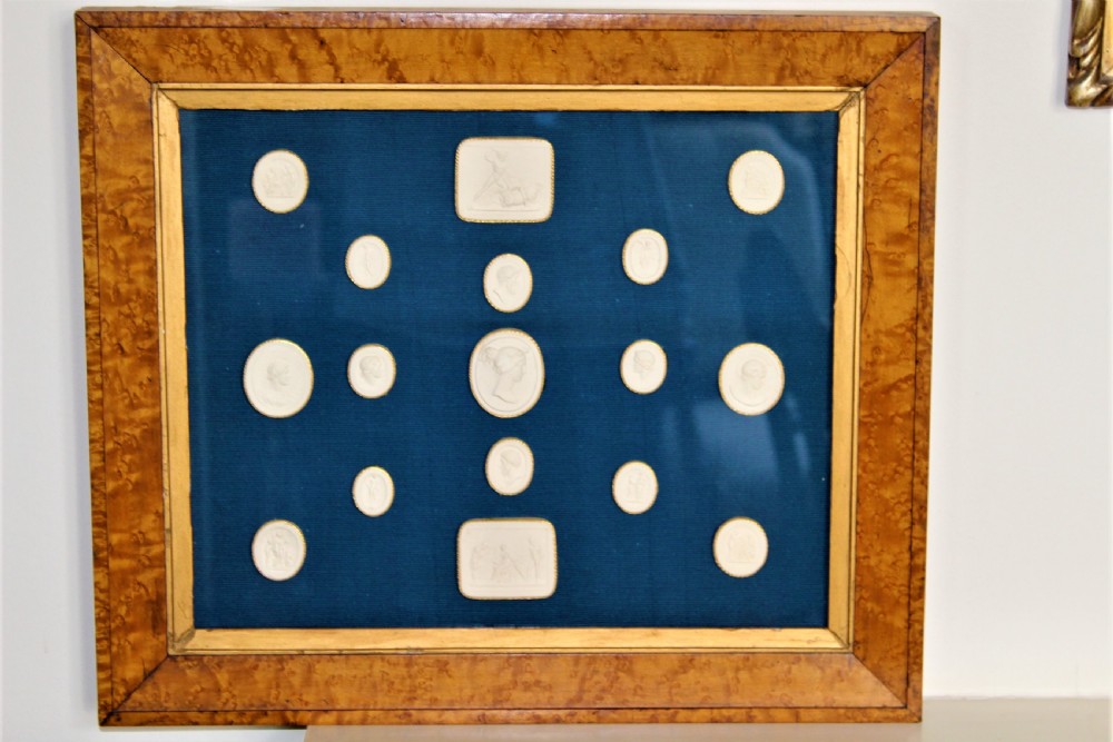 Set of 17 Framed plaster Intaglios Coiled in gold Paper