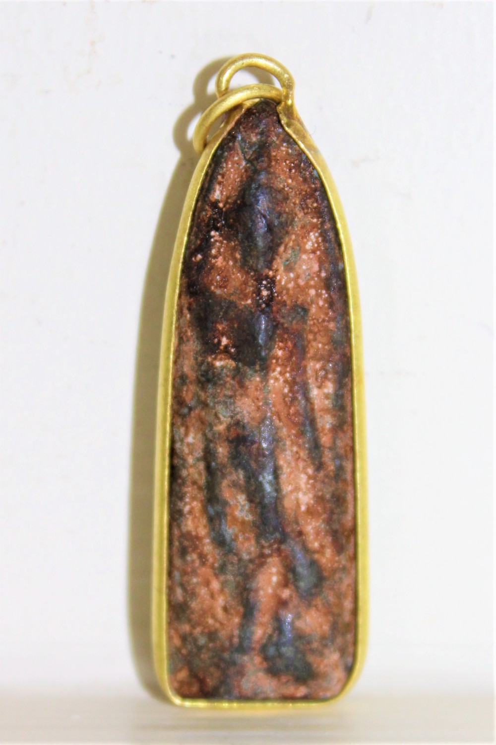 An interesting early pendant of a Deity 