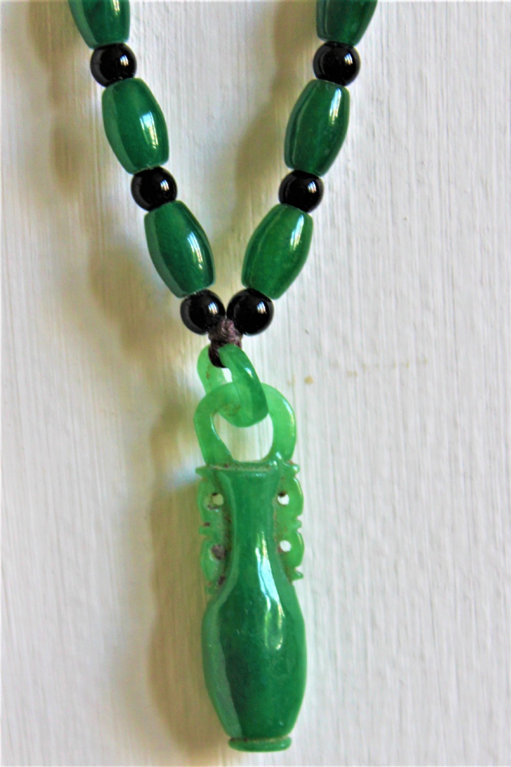 A Spinach Green Jade Necklace and Pendant 