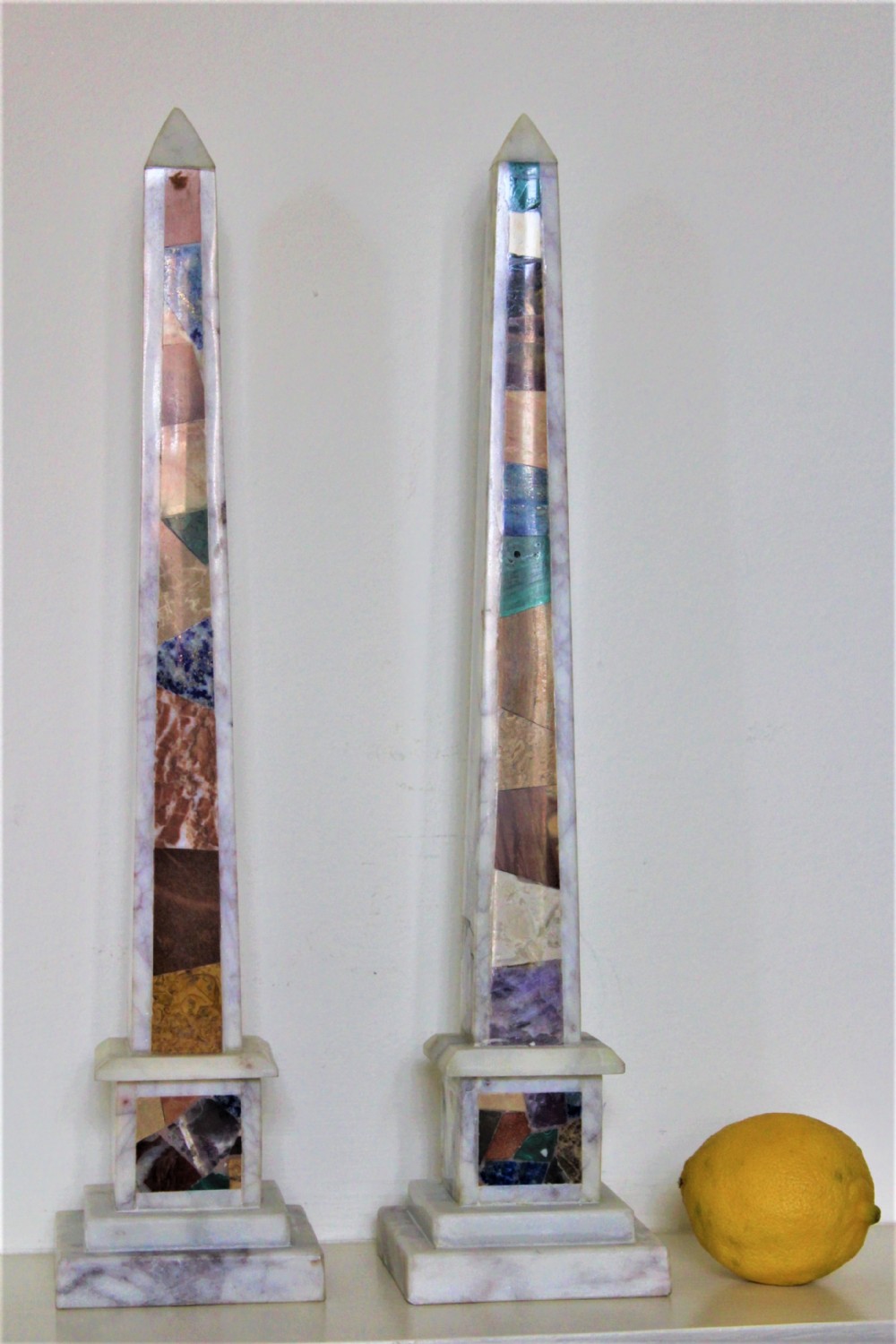 Pair of tall white marble obelisks with various coloured specimen marbles Italian Circa 1930