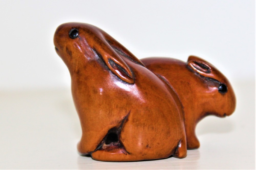 A charming Japanese boxwood netsuke of a mouse and rabbit very good patina Circa 1880