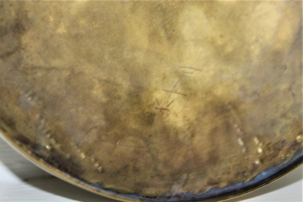 A circular brown bronze box lid decorated with high relief figures under cherry blossoms highlighted in gold and silver metal inlay. View VI