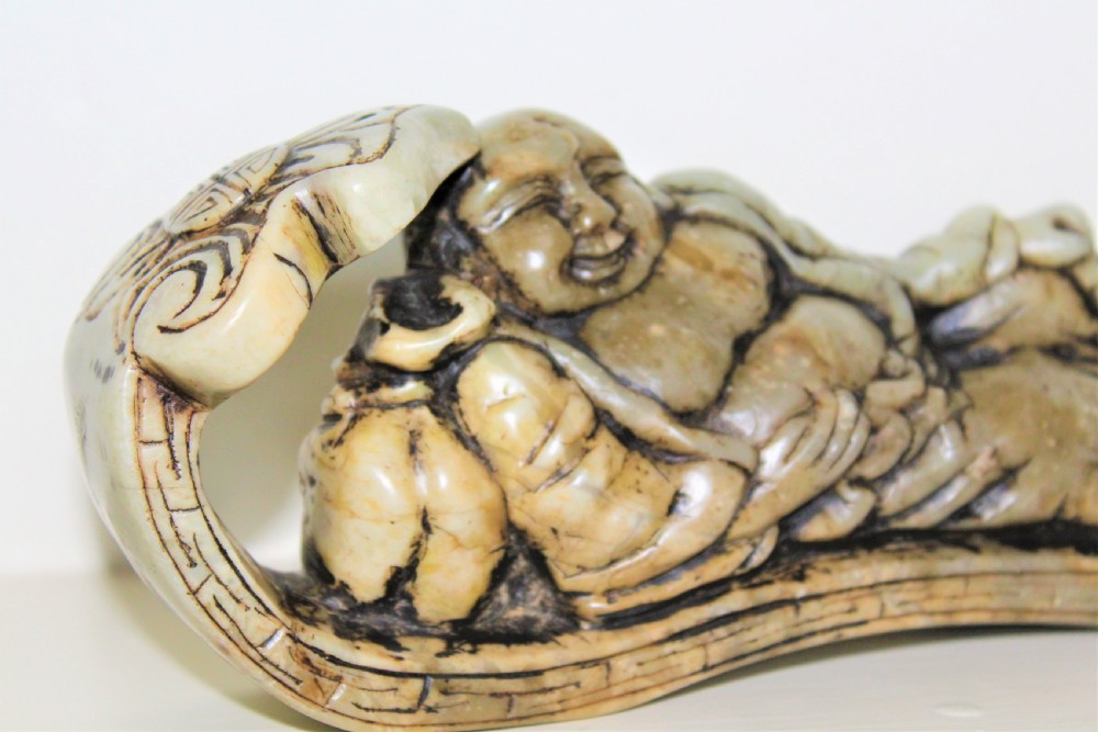 Well carved large Chinese soapstone seal depicting a Buddha reclining on a ruyi sceptre with calligraphy Circa 1880 View II