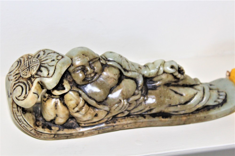 Well carved large Chinese soapstone seal depicting a Buddha reclining on a ruyi sceptre with calligraphy Circa 1880