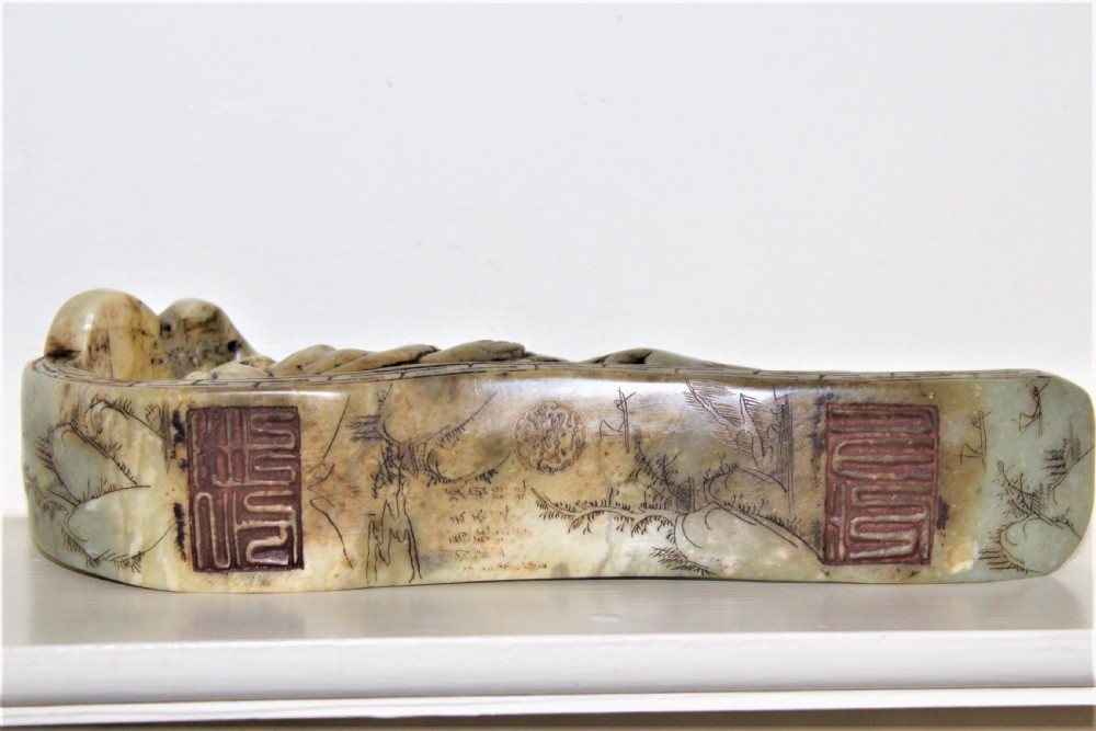 Well carved large Chinese soapstone seal depicting a Buddha reclining on a ruyi sceptre with calligraphy Circa 1880 View V