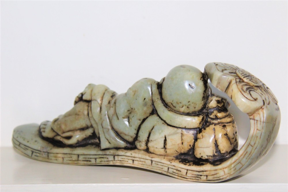 Well carved large Chinese soapstone seal depicting a Buddha reclining on a ruyi sceptre with calligraphy Circa 1880 View IX