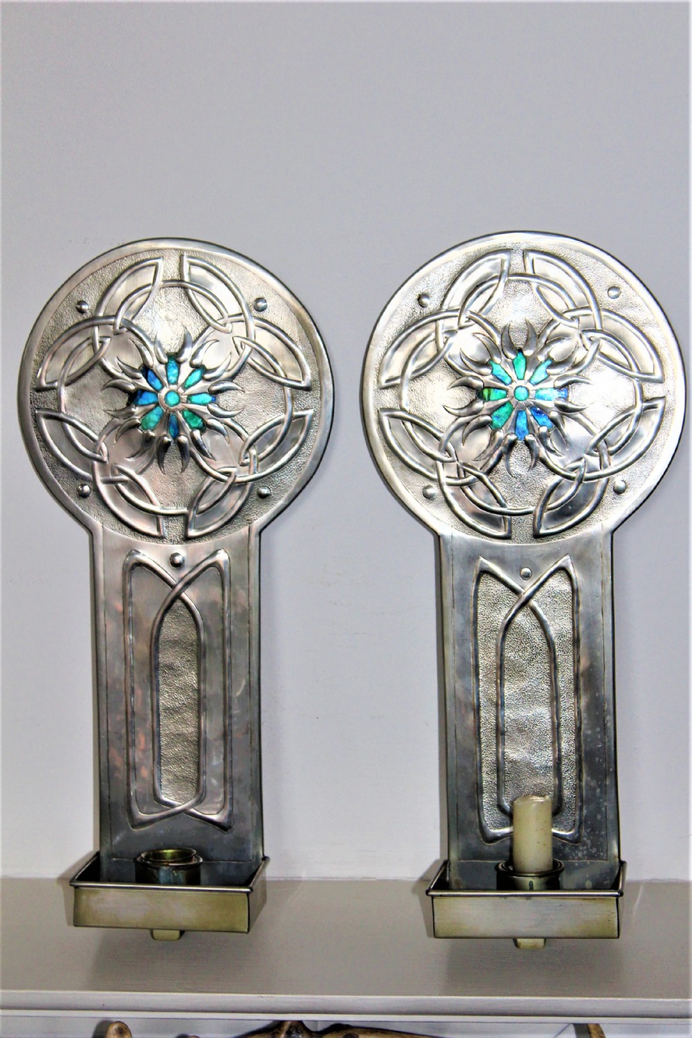 A pair of very stylish Arts and Crafts plated and enamel candle wall sconces possibly English Circa 1900 to 1930