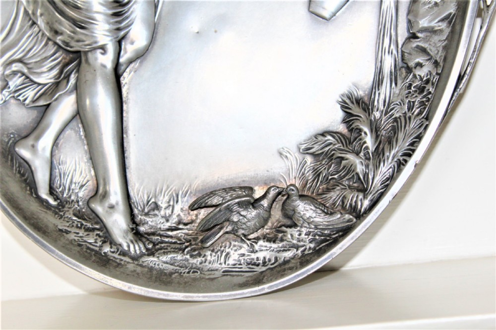 A fine large pewter Art  Nouveau plaque depicting a beautiful maiden filling a ewer at a well continental Circa 1890 to 1910 and small hall marks View V