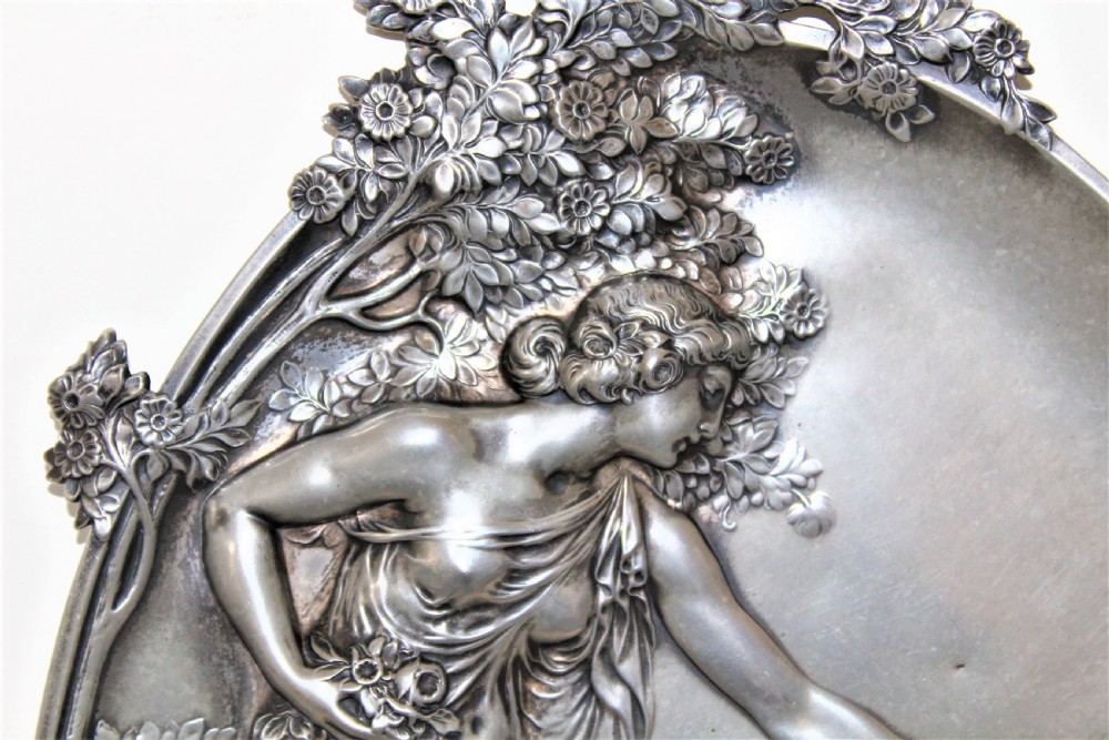 A fine large pewter Art  Nouveau plaque depicting a beautiful maiden filling a ewer at a well continental Circa 1890 to 1910 and small hall marks View VI