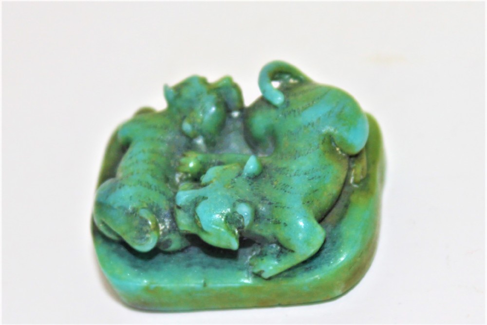 Finely carved hard stone signed netsuke