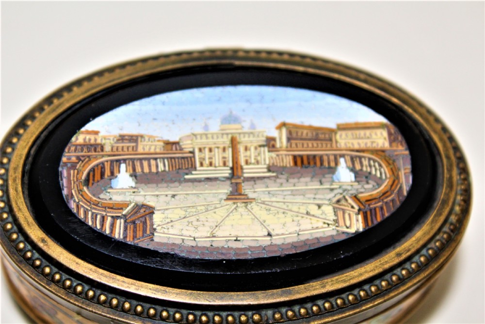 A fine 19th century Italian Grand Tour Micro Mosaic gilt metal box the oval depicting St Marks Square View II