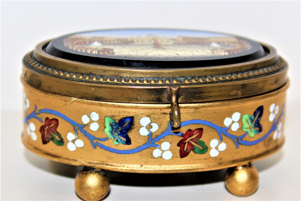 A fine 19th century Italian Grand Tour Micro Mosaic gilt metal box the oval depicting St Marks Square View III