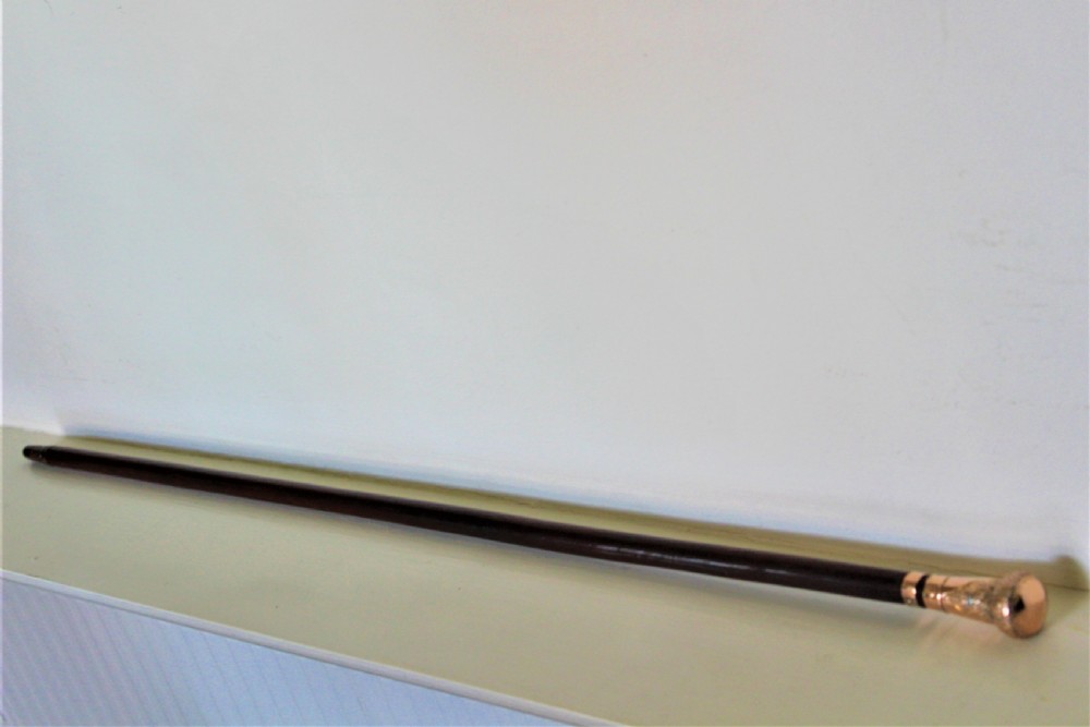 A very fine gold topped lady,s walking stick. The shaft is made of mahogany Circa 1919  View III