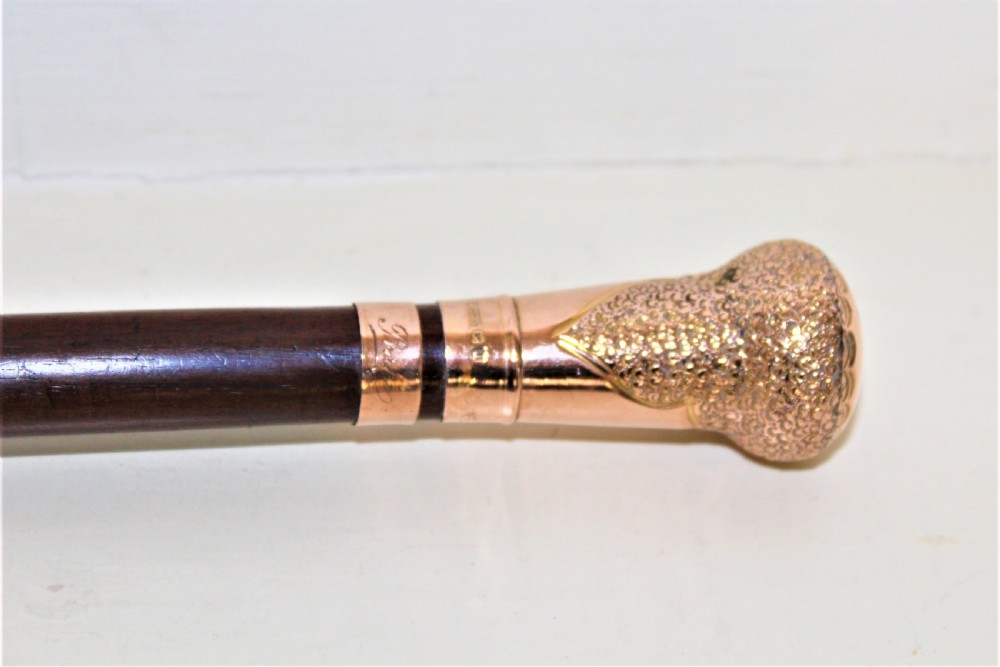 A very fine gold topped lady,s walking stick. The shaft is made of mahogany Circa 1919  View V