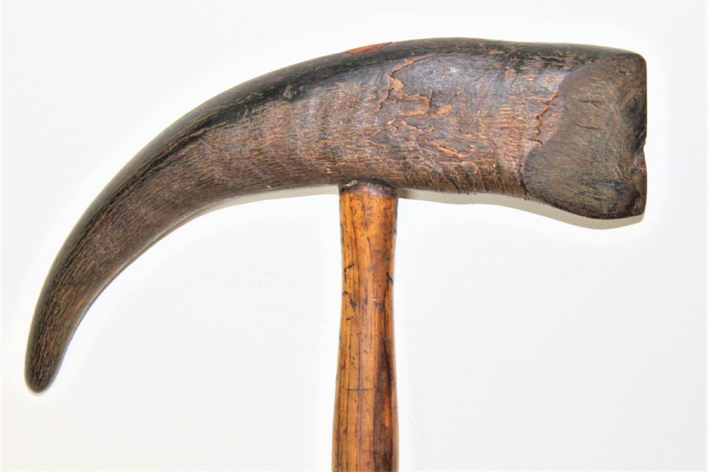 A mid-19th-century Nordic ice pick featuring a curved dark goat horn head mounted perpendicularly onto a turned oak wood shaft. View III