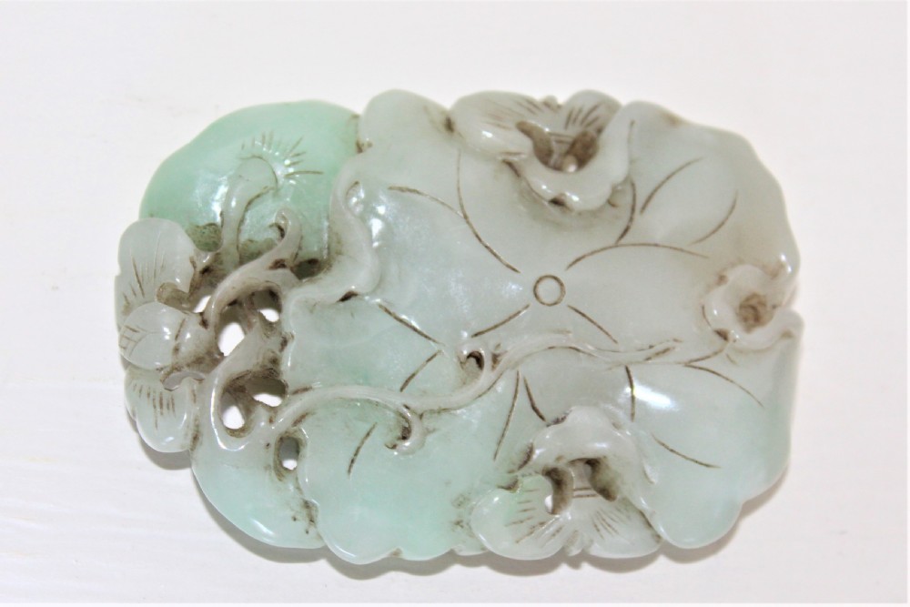 Chinese finely carved and pierced jade pendant of a lotus flower Circa 1880 to 1920 View III