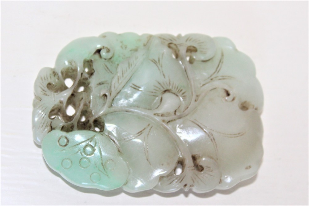 Chinese finely carved and pierced jade pendant of a lotus flower Circa 1880 to 1920 View IV